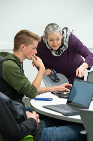 Teacher instructing student